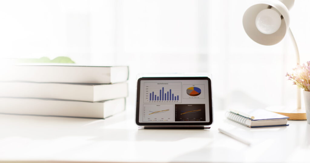 Tablet displaying financial charts and savings data for net zero home cost analysis in Ontario
