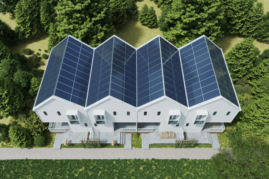Aerial top view of multiple Ontario homes with full rooftop solar panel arrays in a net zero neighborhood