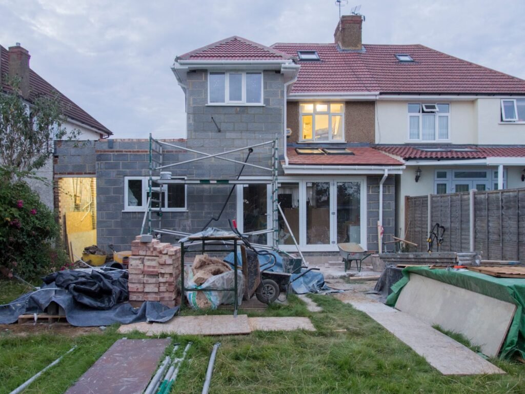 House with scaffolding during a home addition and renovation