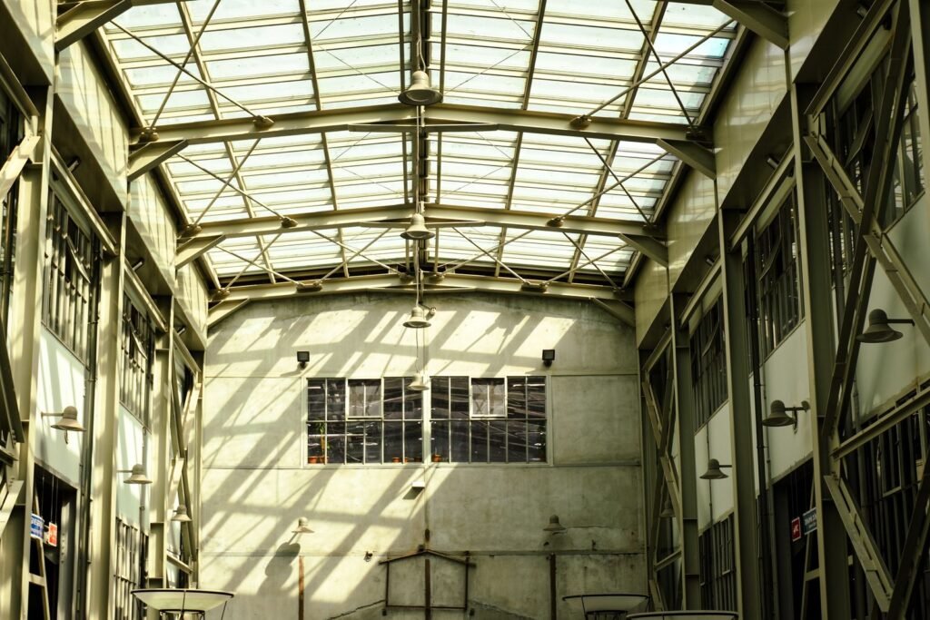 Large warehouse interior with a glass roof