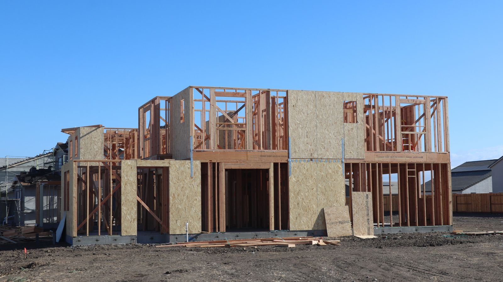Wood framing of a new detached house under construction, the stage where development charges come due on a new home
