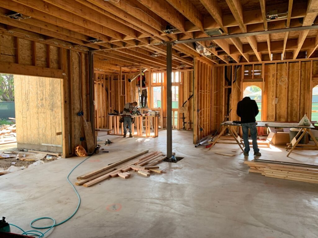 Carpenters framing the structure of a home addition